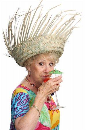 simsearch:400-08040653,k - A beautiful senior woman on vacation sipping a tropical cocktail.  Isolated Stock Photo - Budget Royalty-Free & Subscription, Code: 400-05020354