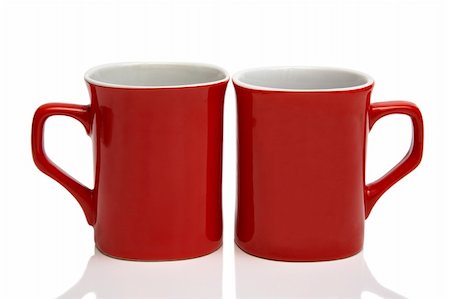 Two red cups on a white background Stock Photo - Budget Royalty-Free & Subscription, Code: 400-05020574