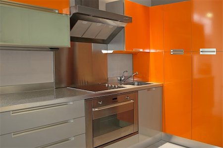simsearch:400-08315056,k - New modern kitchen in orange with metal Fotografie stock - Microstock e Abbonamento, Codice: 400-05020935