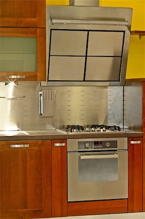 simsearch:400-08315056,k - Modern stainless steel stove and kitchen ventilation Fotografie stock - Microstock e Abbonamento, Codice: 400-05020937