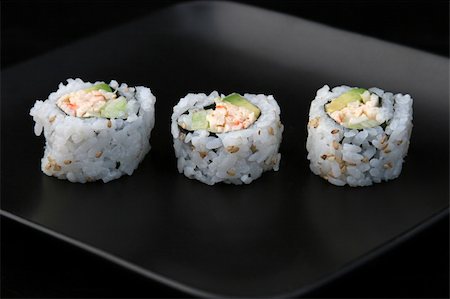 California roll on a black plate and black background. Stock Photo - Budget Royalty-Free & Subscription, Code: 400-05021108