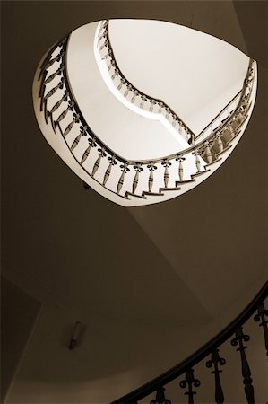 Spiral staircase in an old house, sepia tone. Stock Photo - Budget Royalty-Free & Subscription, Code: 400-05021252