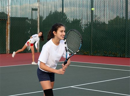 doubles tennis players - Two girls playing tennis Stock Photo - Budget Royalty-Free & Subscription, Code: 400-05021563