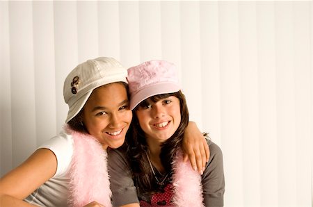 Two teenage girl friends hugging each other and smiling Stock Photo - Budget Royalty-Free & Subscription, Code: 400-05021739