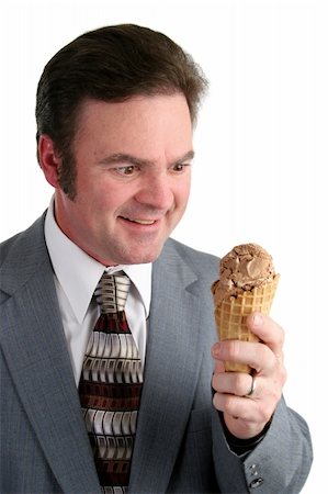 excited ice cream - A handsome businessman looking excitedly at a chocolate ice cream cone. Stock Photo - Budget Royalty-Free & Subscription, Code: 400-05021840