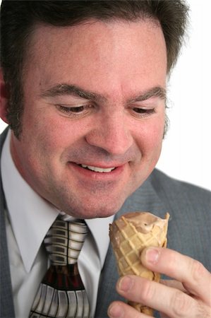 excited ice cream - A closeup of a businessman looking at an ice cream cone with love. Stock Photo - Budget Royalty-Free & Subscription, Code: 400-05021841
