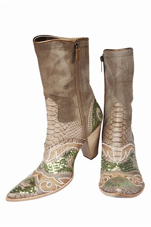 simsearch:400-08498619,k - Cowboy's boots with an ornament on a white background Photographie de stock - Aubaine LD & Abonnement, Code: 400-05021889