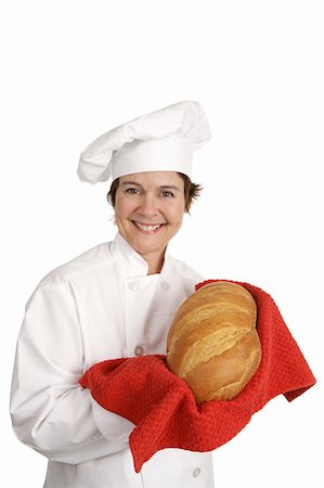 Cute female chef holding up a beautiful loaf of Italian Bread.  Isolated on white. Stock Photo - Budget Royalty-Free & Subscription, Code: 400-05022149