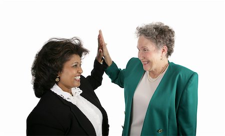 A diverse female business team giving eachother high-fives.  Isolated on white. Stock Photo - Budget Royalty-Free & Subscription, Code: 400-05022175