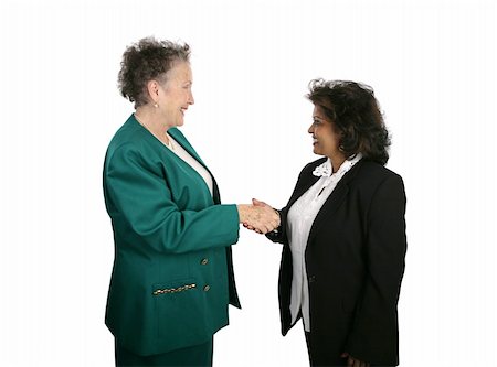 A diverse female business team shaking hands.  Isolated on white. Stock Photo - Budget Royalty-Free & Subscription, Code: 400-05022176