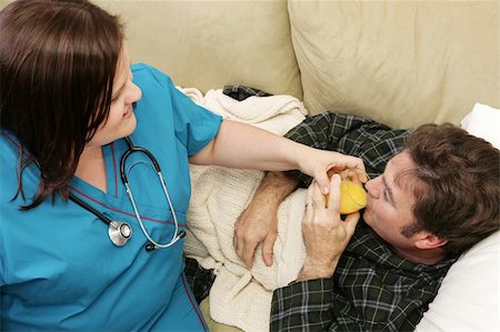 pictures of fat orange women - A home health nurse helping her patient drink orange juice.  Focus on him. Stock Photo - Budget Royalty-Free & Subscription, Code: 400-05022193