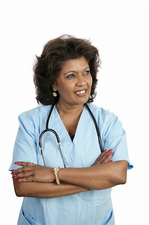 A doctor or nurse in scrubs, lost in thought.  Isolated on white. Stock Photo - Budget Royalty-Free & Subscription, Code: 400-05022218