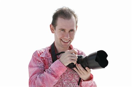 Portrait of a handsome young photographer on the beach. Photographie de stock - Aubaine LD & Abonnement, Code: 400-05022224