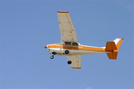 Small Aircraft at the blue sky Fotografie stock - Microstock e Abbonamento, Codice: 400-05022251