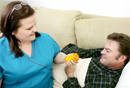 fat men in uniform - Home health nurse preparing to give her patient his medicine. Stock Photo - Budget Royalty-Free & Subscription, Code: 400-05022329