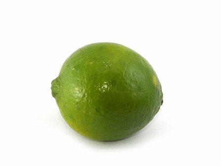 simsearch:400-05057164,k - One green lime liyng on the white background Fotografie stock - Microstock e Abbonamento, Codice: 400-05022614