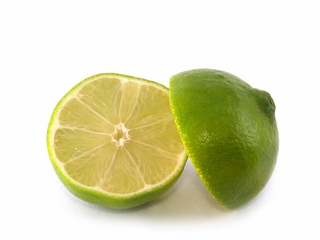 simsearch:400-05057164,k - Two halves of  lime liyng on the white background Fotografie stock - Microstock e Abbonamento, Codice: 400-05022645