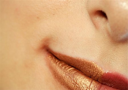 simsearch:400-05676902,k - Macro image of bright lips. Red and gold lipstik Stock Photo - Budget Royalty-Free & Subscription, Code: 400-05023179