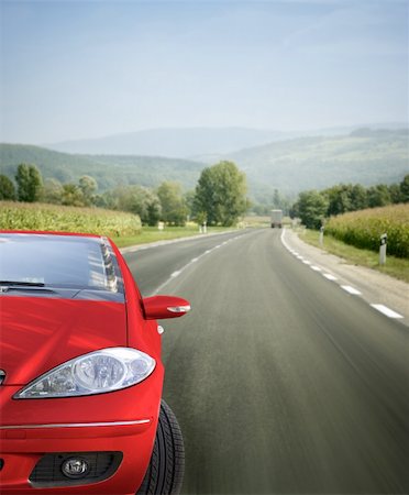 speed sedan - Red car on the road Stock Photo - Budget Royalty-Free & Subscription, Code: 400-05023186