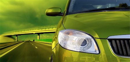 simsearch:400-05038645,k - Green car on the road Stock Photo - Budget Royalty-Free & Subscription, Code: 400-05023187