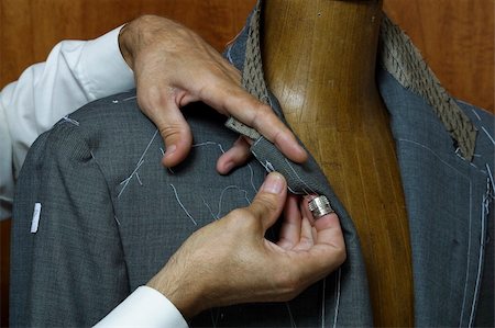 Tailor's hands crafting man's suite just on the wooden ancient mannequin Stock Photo - Budget Royalty-Free & Subscription, Code: 400-05023214