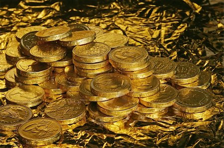 Pile of golden chocolate coins on golden background Stock Photo - Budget Royalty-Free & Subscription, Code: 400-05023693