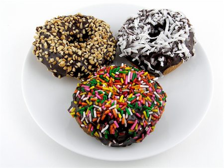 simsearch:400-06524508,k - A trio of frosted chocolate doughnuts Stock Photo - Budget Royalty-Free & Subscription, Code: 400-05023756