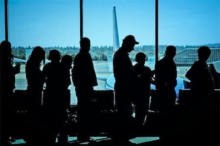 family and airport terminal - Travelers standing in line at the airport waiting to board an airplane Stock Photo - Budget Royalty-Free & Subscription, Code: 400-05023772