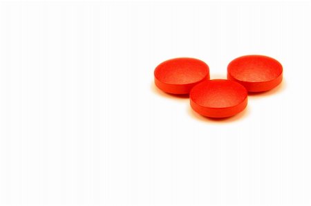 Three red pills isolated on white. Stock Photo - Budget Royalty-Free & Subscription, Code: 400-05034086