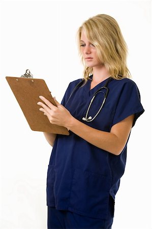 simsearch:400-03995908,k - Pretty young woman healthcare worker wearing blue scrubs and a stethoscope holding a clipboard standing on white Stock Photo - Budget Royalty-Free & Subscription, Code: 400-05034236