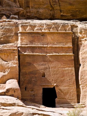 simsearch:400-04497075,k - Small tombs in Petra (Street of Facades part) - Nabataeans capital city (Al Khazneh) , Jordan. Made by digging a holes in the rocks. Roman Empire period. Photographie de stock - Aubaine LD & Abonnement, Code: 400-05034357