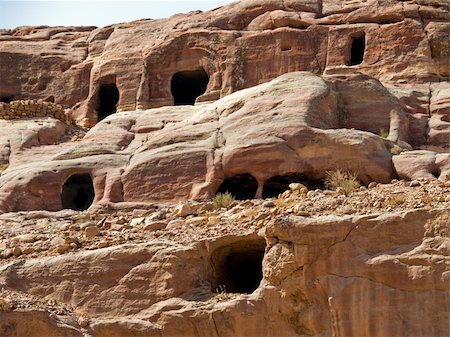 simsearch:400-04497075,k - Small tombs in Petra (Street of Facades part) - Nabataeans capital city (Al Khazneh) , Jordan. Made by digging a holes in the rocks. Roman Empire period. Photographie de stock - Aubaine LD & Abonnement, Code: 400-05034359