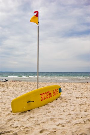 iconic surf rescue board and swimming flags Stock Photo - Budget Royalty-Free & Subscription, Code: 400-05034566