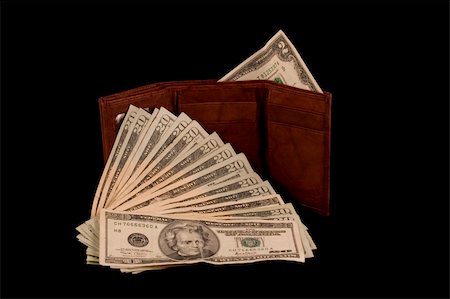 Wallet with a two dollar bill and some twenties isolated on black Stock Photo - Budget Royalty-Free & Subscription, Code: 400-05034598