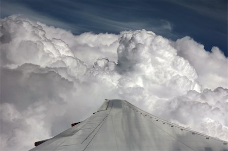 plane rain - Wing of the plane on a background of clouds Stock Photo - Budget Royalty-Free & Subscription, Code: 400-05035077