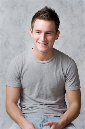 Handsome, cute male in a t-shirt, smiling Foto de stock - Royalty-Free Super Valor e Assinatura, Número: 400-05035094
