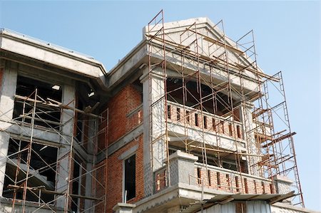Construction of a new bungalow house site with scaffolding Stock Photo - Budget Royalty-Free & Subscription, Code: 400-05035669