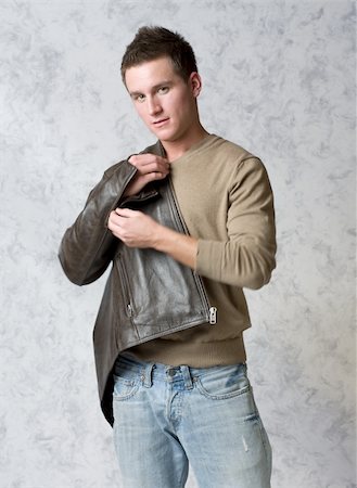 Sexy man with v-neck sweater and leather jacket Foto de stock - Royalty-Free Super Valor e Assinatura, Número: 400-05035854