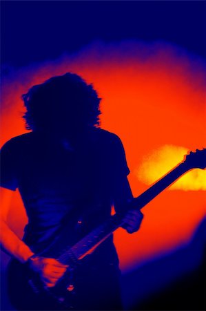 stage with band equipment - The silhouette of a guitar player performing live concert. Stock Photo - Budget Royalty-Free & Subscription, Code: 400-05036503