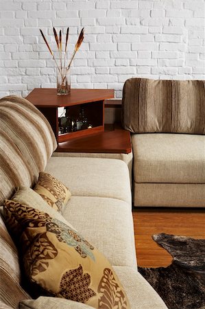 simsearch:400-04840458,k - Sofa and little table on a background of a brick wall Stock Photo - Budget Royalty-Free & Subscription, Code: 400-05036712