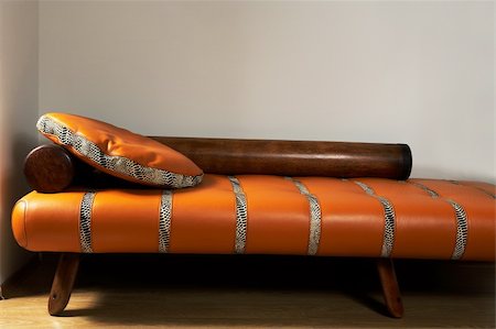simsearch:400-04840458,k - Leather stylish sofa on a background of a wall Stock Photo - Budget Royalty-Free & Subscription, Code: 400-05036713