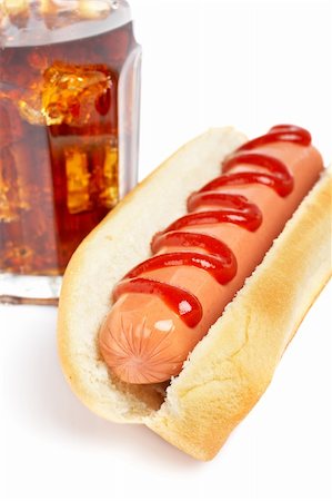 A hot dog and soda glass with shadow on white background. Shallow DOF Stock Photo - Budget Royalty-Free & Subscription, Code: 400-05036797