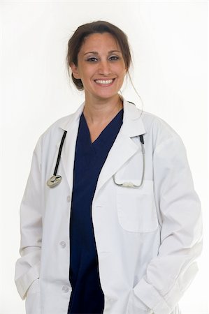 Brunette lady doctor wearing white lab coat with a stethoscope around shoulders smiling standing on white background Stock Photo - Budget Royalty-Free & Subscription, Code: 400-05036823