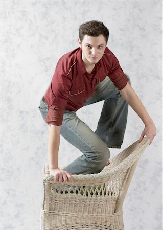 simsearch:400-03995127,k - Man with a wicker chair Stock Photo - Budget Royalty-Free & Subscription, Code: 400-05036830