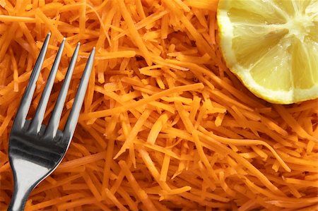 julienne carrots salade with lemon and fork Stock Photo - Budget Royalty-Free & Subscription, Code: 400-05037552