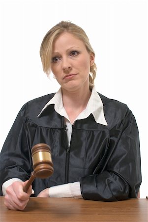 disapproving black woman - Blond stern looking woman judge holding a gavel  over white background Stock Photo - Budget Royalty-Free & Subscription, Code: 400-05037763