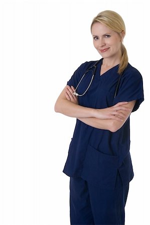 simsearch:400-03995908,k - Attractive smiling blond nurse with arms crossed wearing stethoscope on white background Stock Photo - Budget Royalty-Free & Subscription, Code: 400-05037774