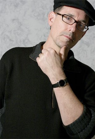 Adult male with black sweater, black cap and glasses Foto de stock - Royalty-Free Super Valor e Assinatura, Número: 400-05037957