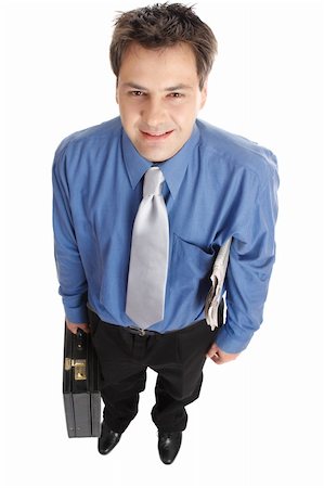 simsearch:400-03996768,k - Confident smiling professional businessmen stands with the financial newsaper under one arm and carrying a briefcase with the other.. Stock Photo - Budget Royalty-Free & Subscription, Code: 400-05037993
