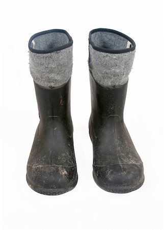 Dark high boots for working in the garden isolated on a white background. Photographie de stock - Aubaine LD & Abonnement, Code: 400-05038028
